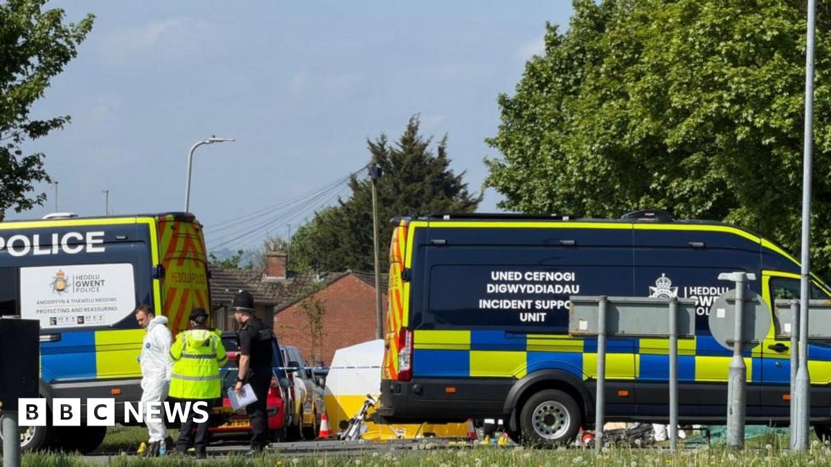 Emergency services staff and vehicles on Aberthaw Road.
