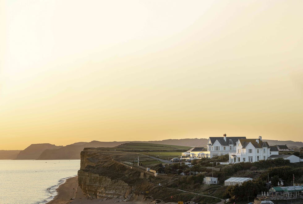 birdseye view of a coastal hotel at sunset birdseye view of a coastal hotel at sunset