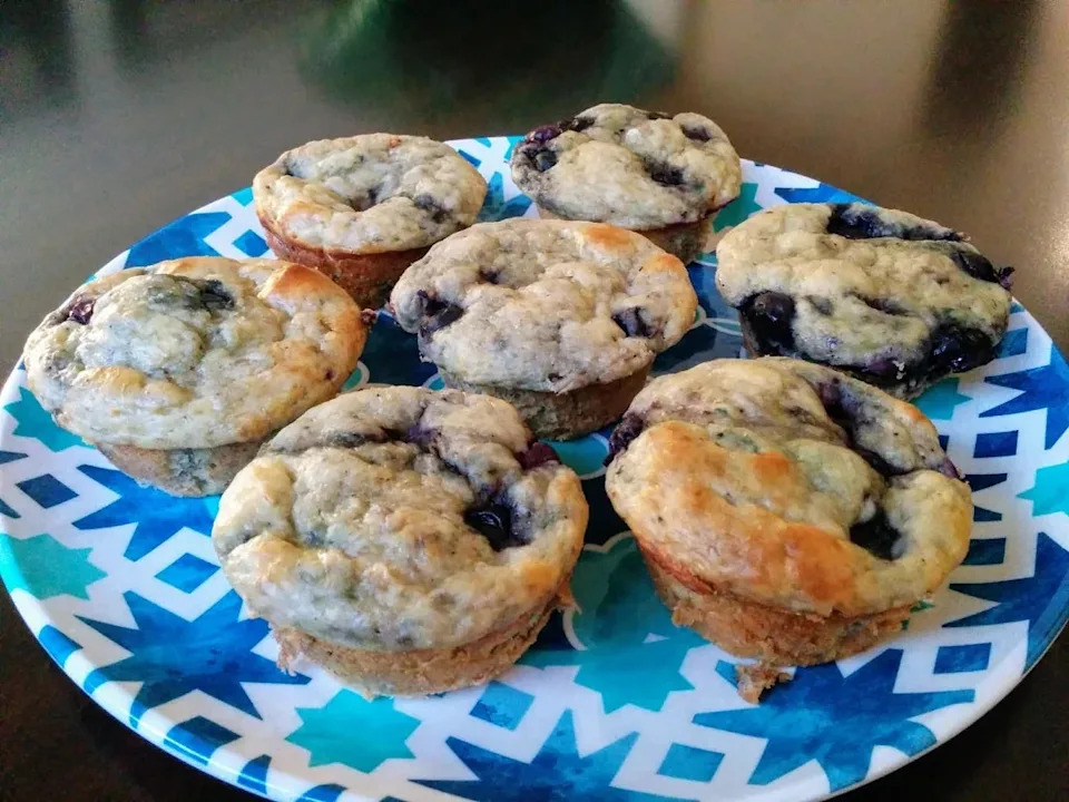 Blueberry muffins arranged on a decorative plate