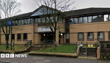 a google view of the exterior view of a sandstone police station building.
