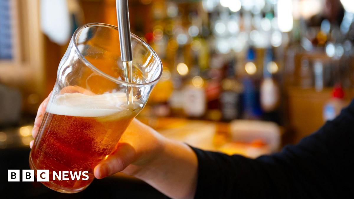 A beer is poured in a bar