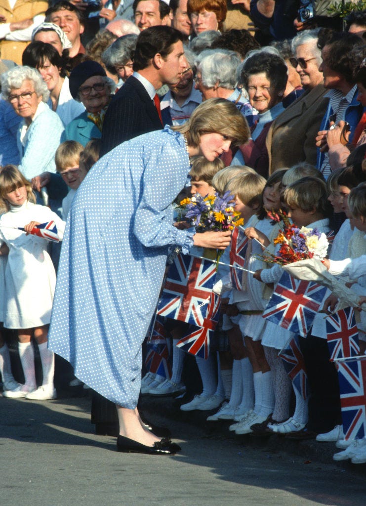isles of scilly, england april 20: prince charles, prince of wales and diana, princess of wales, wearing a blue and white polka dot maternity dress with a ruffled collar designed by catherine walker and black patent flat shoes, meet well wishers during a walkabout in st. marys on the isles of scilly on april 20, 1982 in cornwall, united kingdom. (photo by anwar hussein/getty images)