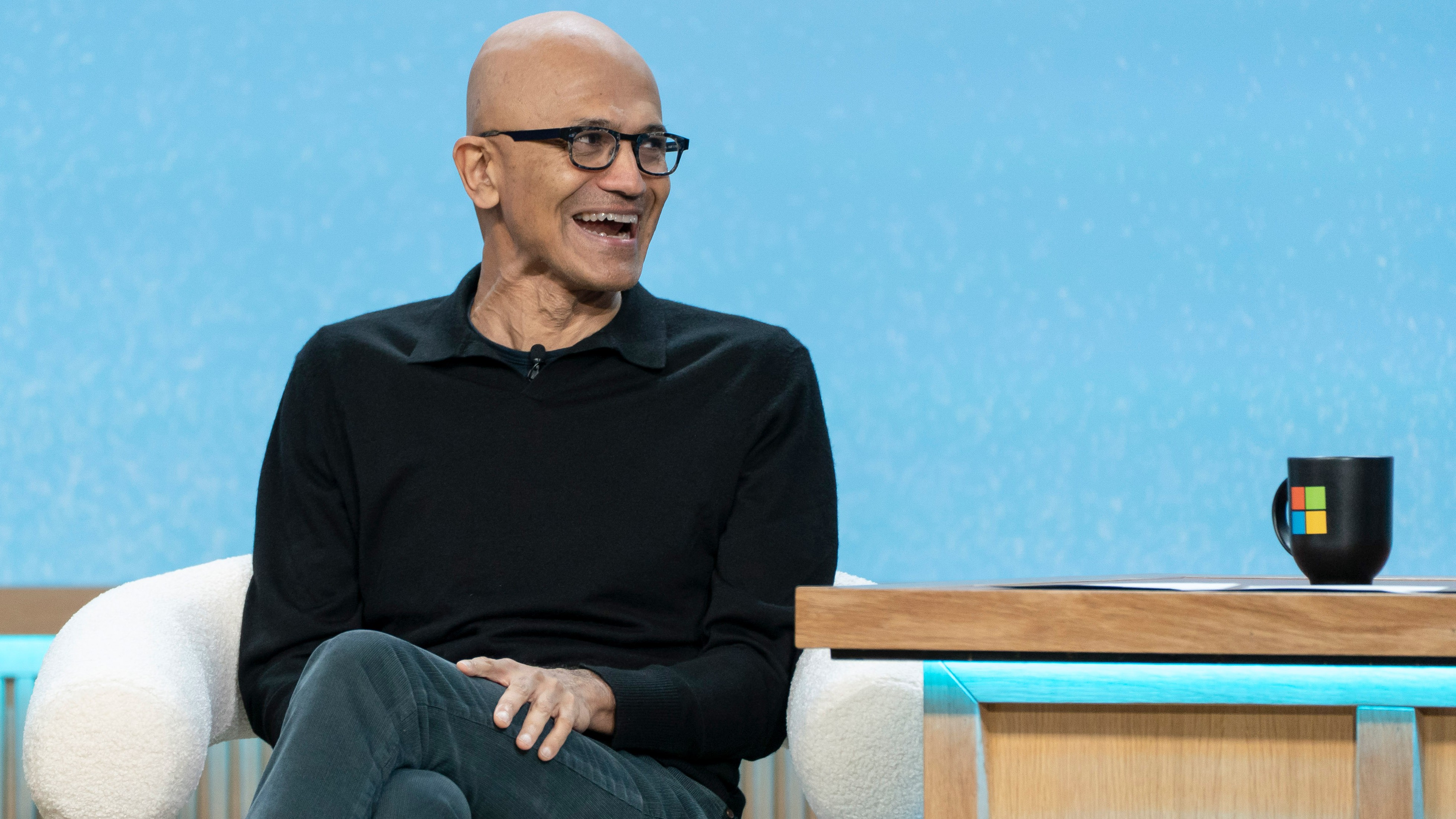 Satya Nadella laughing at the Microsoft 50th Anniversary Copilot event