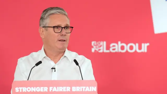 Starmer giving speech at lectern