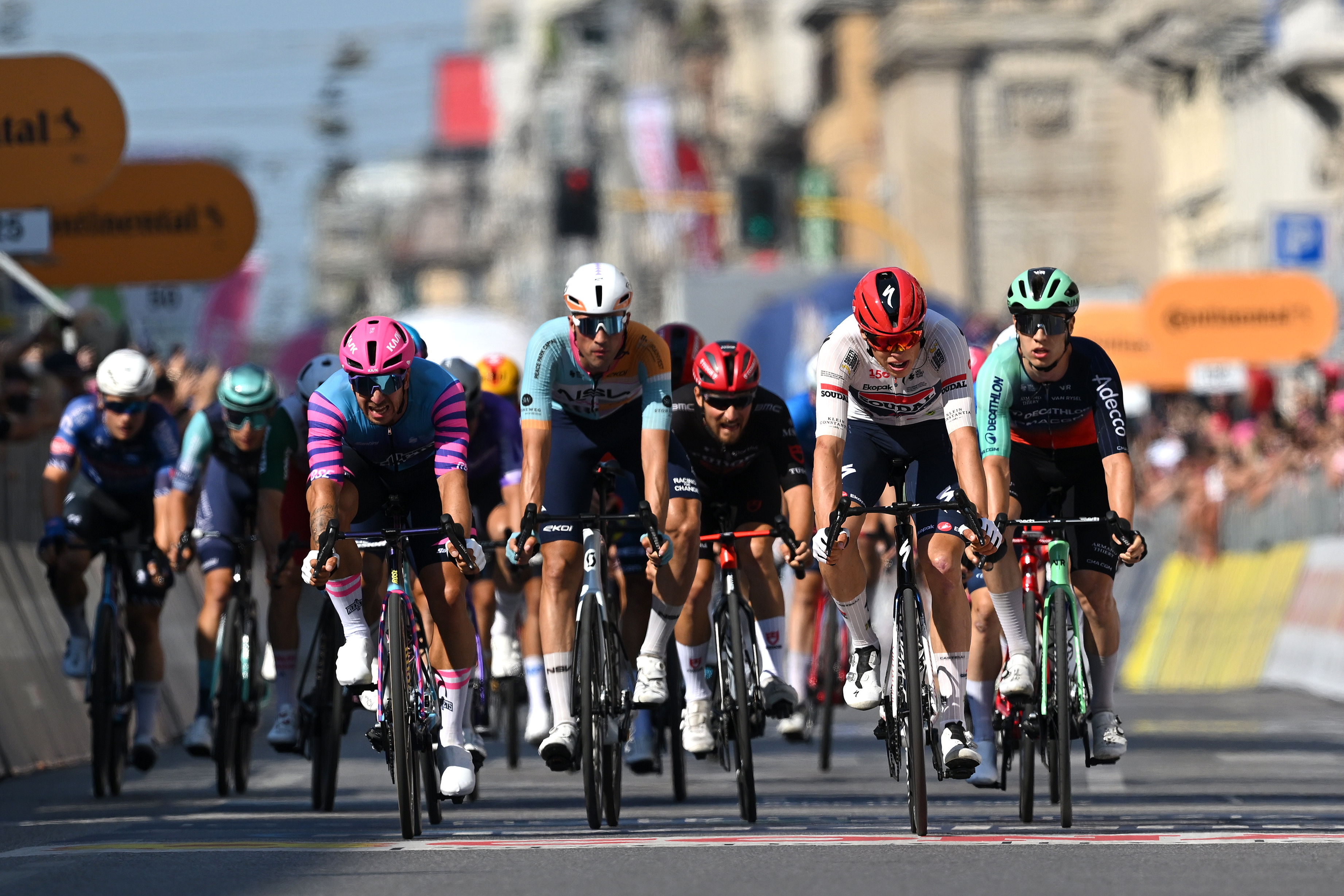 MILAN, ITALY - MAY 24: (L-R) Dylan Groenewegen of Netherlands and Team Unibet Rose Rockets, Ethan Vernon of Great Britain and Team NSN Cycling, Paul Magnier of France and Team Soudal Quick-Step and Tobias Lund Andresen of Denmark and Team Decathlon CMA CGM cross the finish line during the 109th Giro d&amp;apos;Italia 2026, Stage 15 a 157km stage from Voghera to Milan / #UCIWT / on May 24, 2026 in Milan, Italy. (Photo by Tim de Waele/Getty Images)