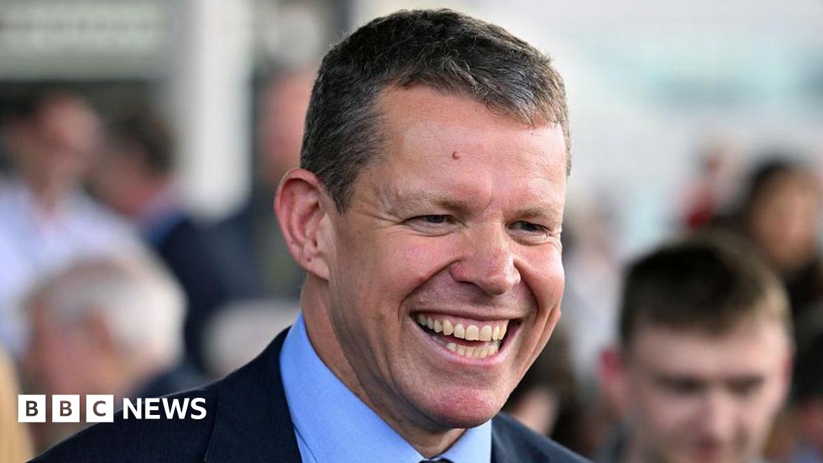 A smiling Rhun ap Iorwerth on the steps of the Senedd building