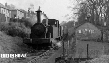 A black and white image showing a daily goods train on the Monkland & Kirkintilloch line travelling between Whitegates and Woodilee, 7 March 1960.