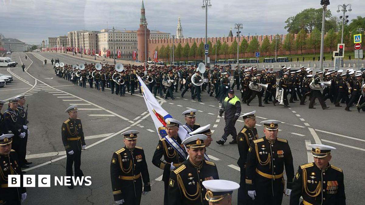 A marching band parades through the streets of Moscow