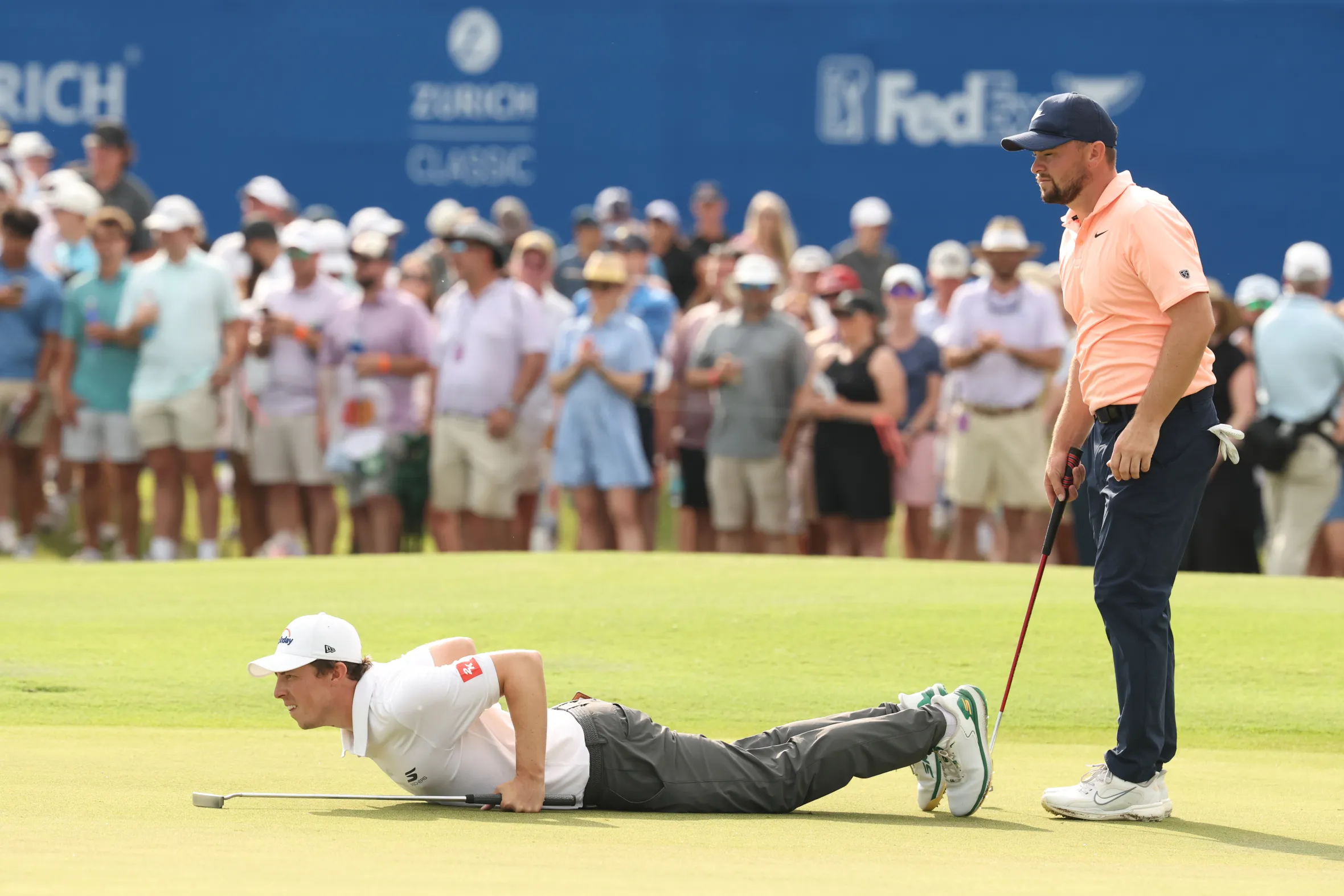 Matt Fitzpatrick and Alex Fitzpatrick line up a putt during the Zurich Classic of New Orleans.