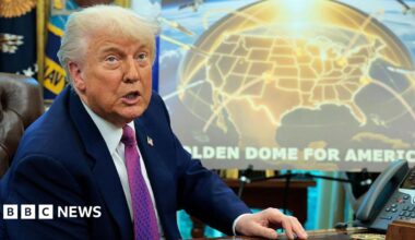 Donald Trump in the Oval Office in front of a Golden Dome poster