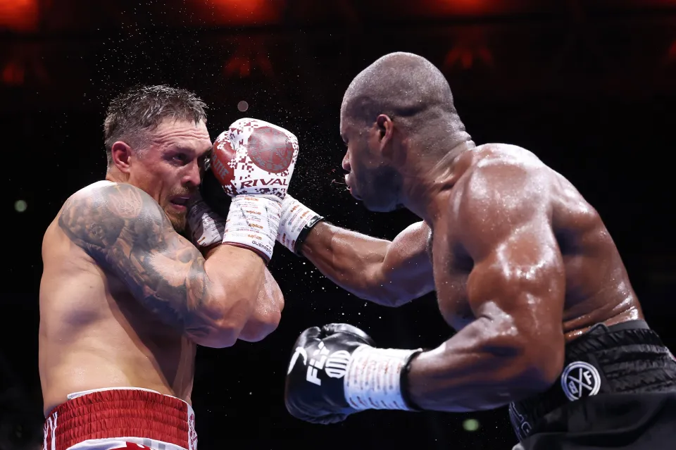 Daniel Dubois punches Oleksandr Usyk during their IBF, IBO, WBC and WBO World Heavyweight titles' fight on the 'Undisputed' fight night card at Wembley Stadium on July 19, 2025 in London, England