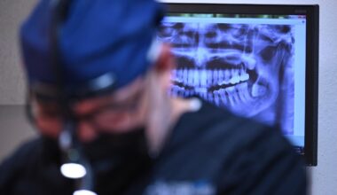 A dentist works on a patient at the Rubio Dental Group offices in Los Algodones, Mexico, just across the border from California and Arizona, on April 11, 2023