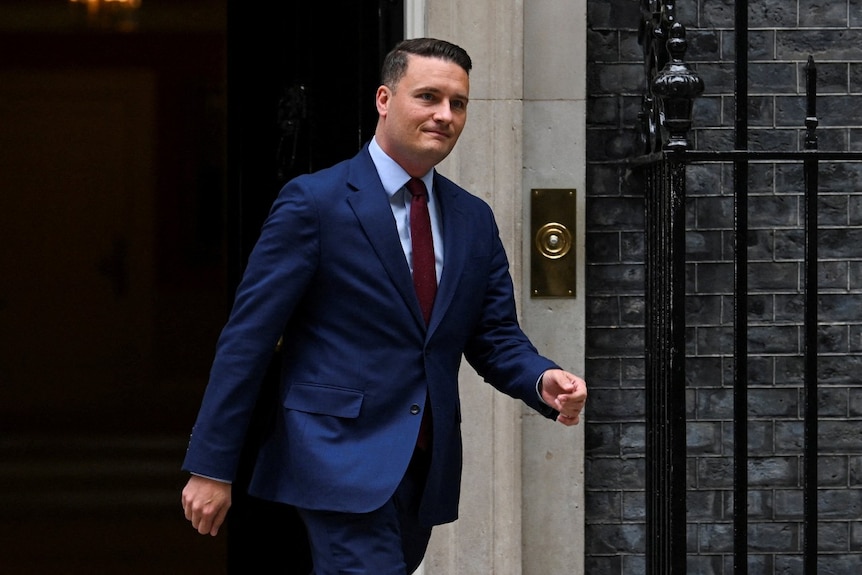A man in a suit outside Downing Street in London