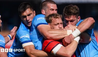 Mike Haley is tackled by the Bulls