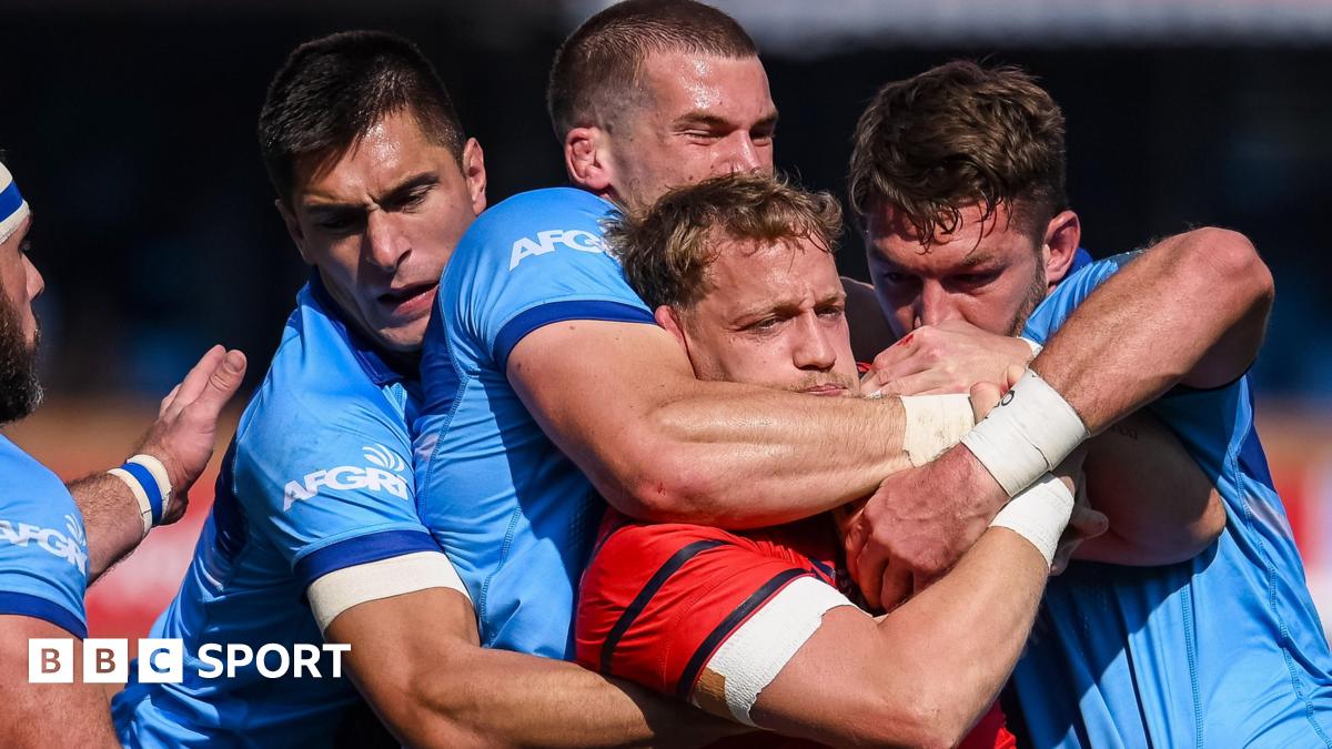 Mike Haley is tackled by the Bulls