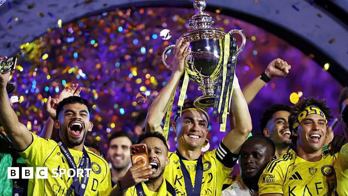 Cristiano Ronaldo of Al-Nassr lifts the Saudi Pro League trophy as he stands with team-mates following the match against Damac