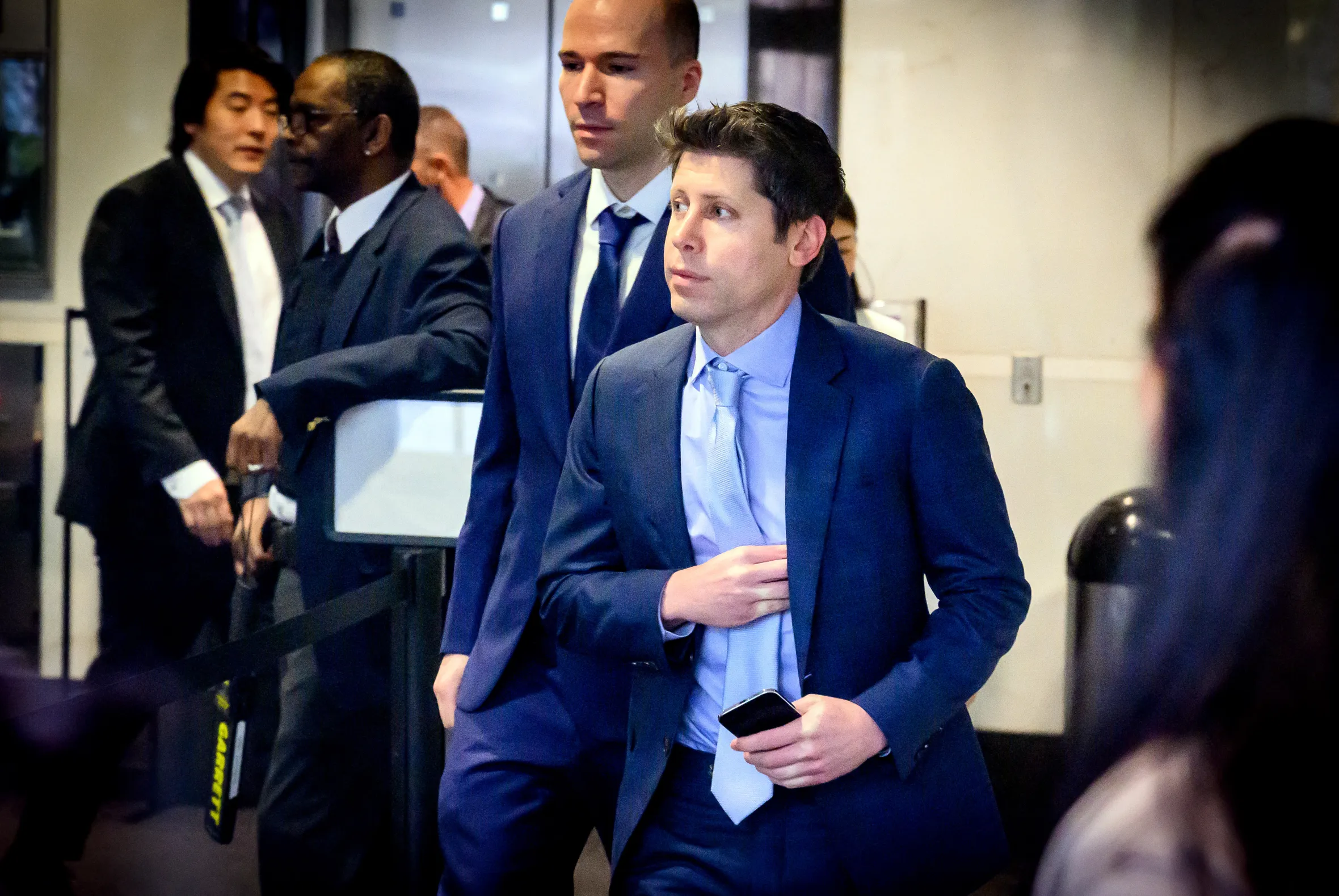 Sam Altman and Greg Brockman arriving at the federal courthouse.