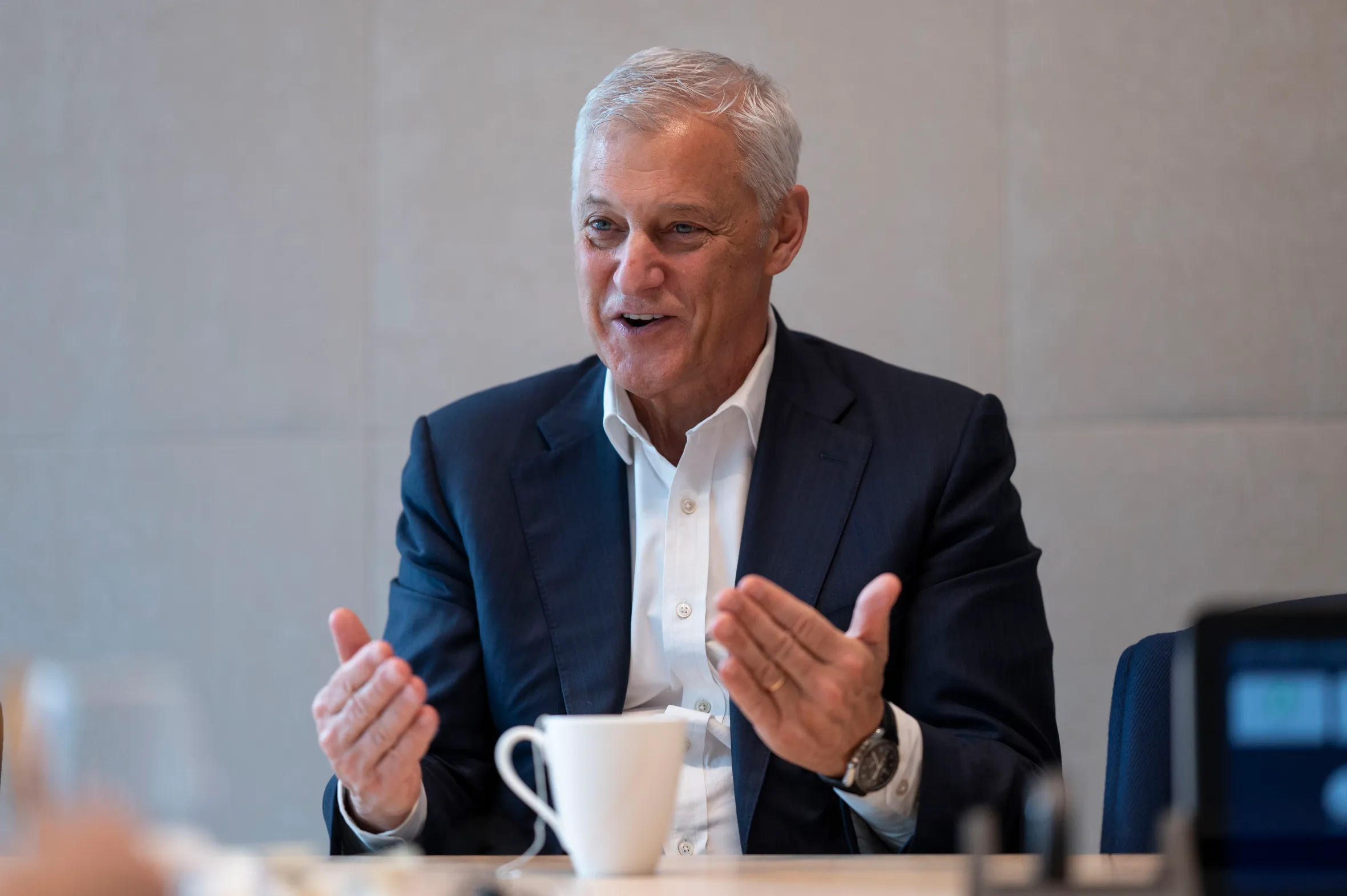 Bill Winters of Standard Chartered speaking at a table.