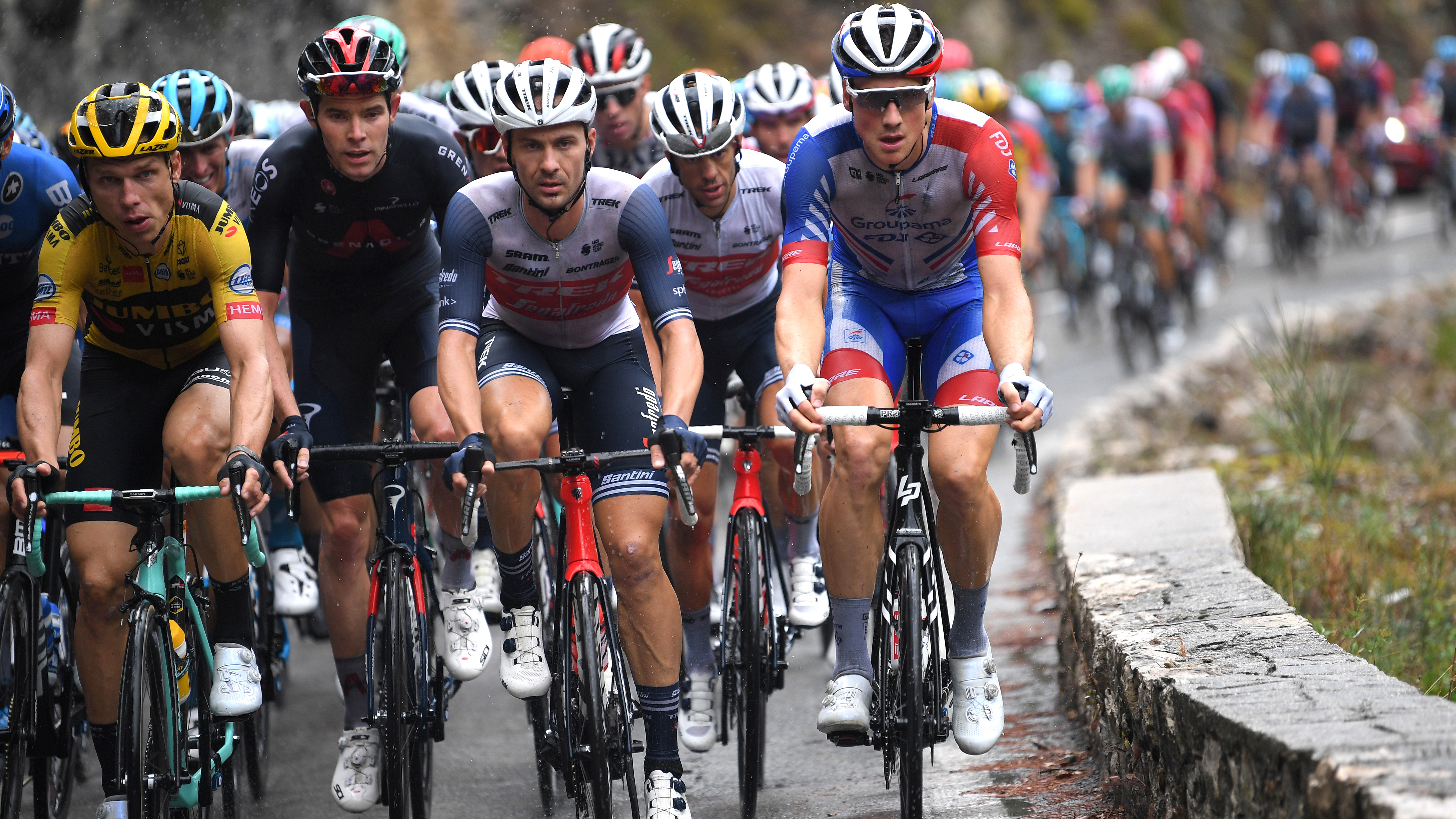 Tony Martin (Jumbo-Visma) and Luke Rowe (Ineos) together on the 2020 Tour (left of photo), a year after they were both sent home for fighting