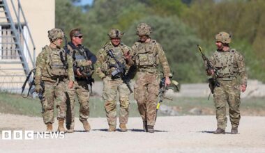 US troops walking with guns during a training exercise in Germany