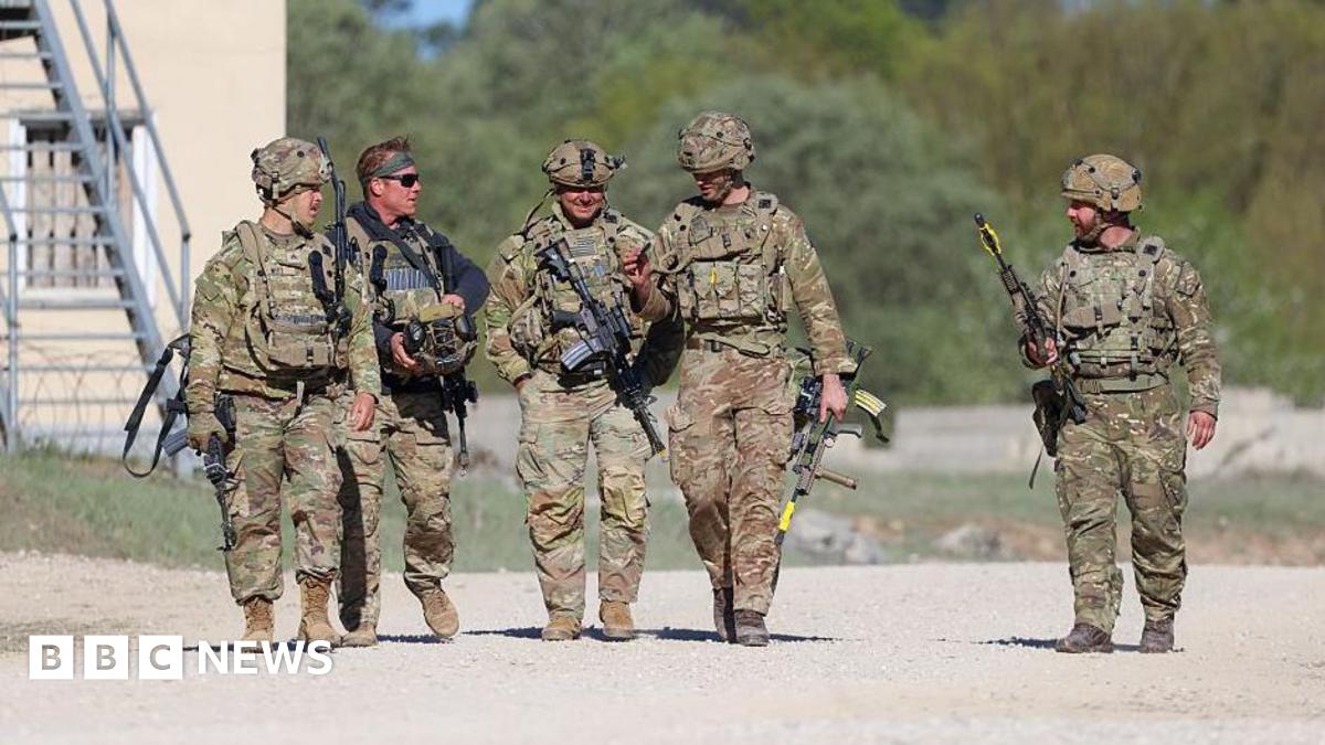 US troops walking with guns during a training exercise in Germany