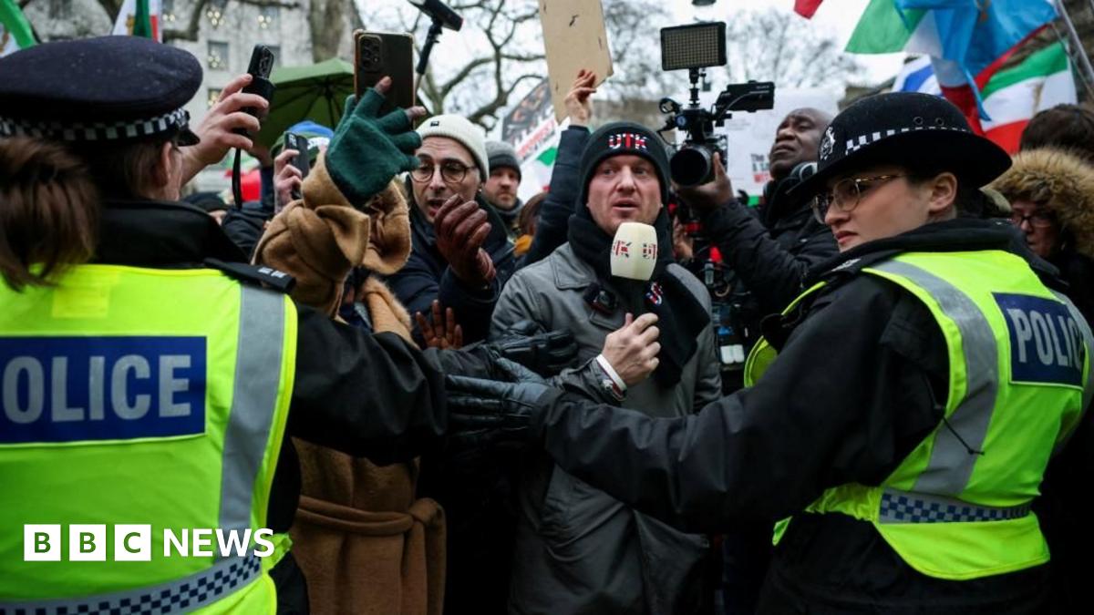 Activist Stephen Yaxley-Lennon, known as Tommy Robinson, wears a Unite the Kingdom beanie at a protest