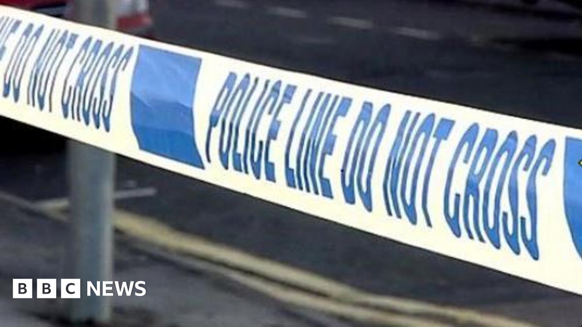 Generic close-up shot of a police cordon with blue writing on a white background
