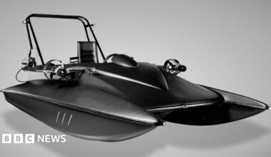A black speed boat-like vessel.