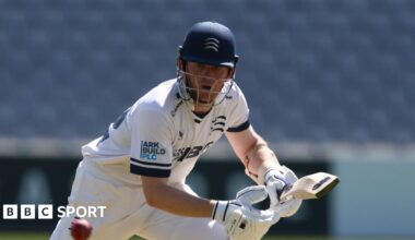 Sam Robson watches carefully as he steers a ball into the offside while batting at a sunny Lord's