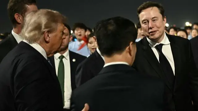 Donald Trump present Tesla CEO Elon Musk to China's Vice-President Han Zheng at Beijing Capital Airport.