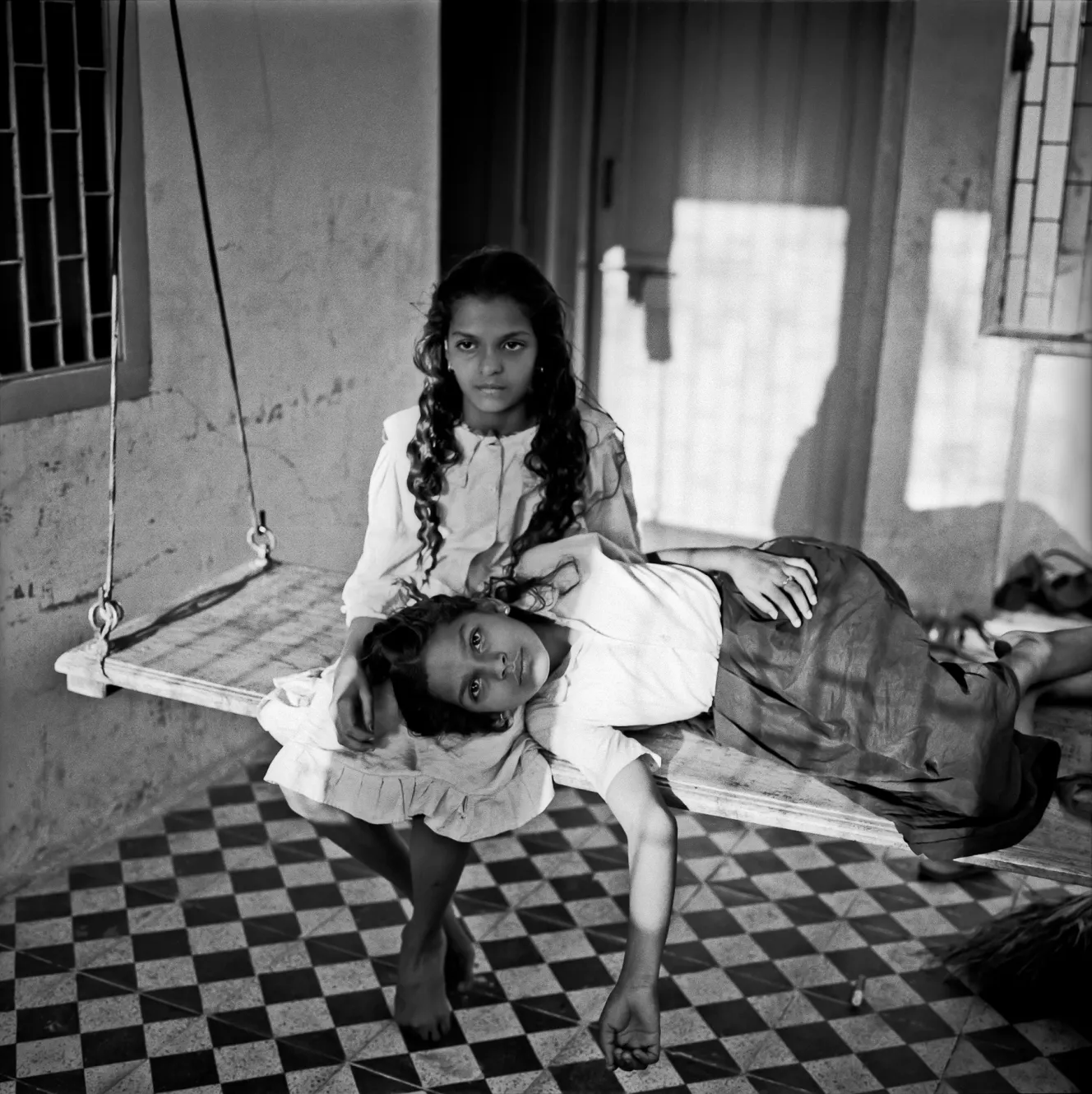 Yesha and Niddhi on a swing, Gujarat.