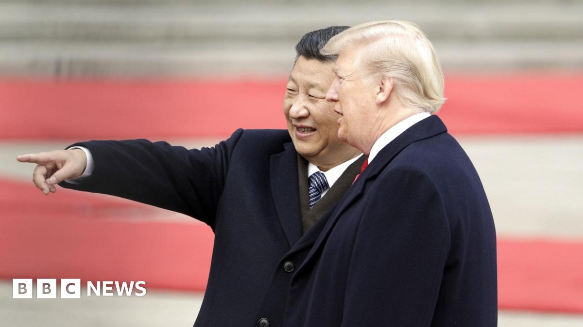 Xi Jinping, China's president, left, gestures while standing next to U.S. President Donald Trump, during a welcome ceremony outside the Great Hall of the People in Beijing, China, in November 2017.