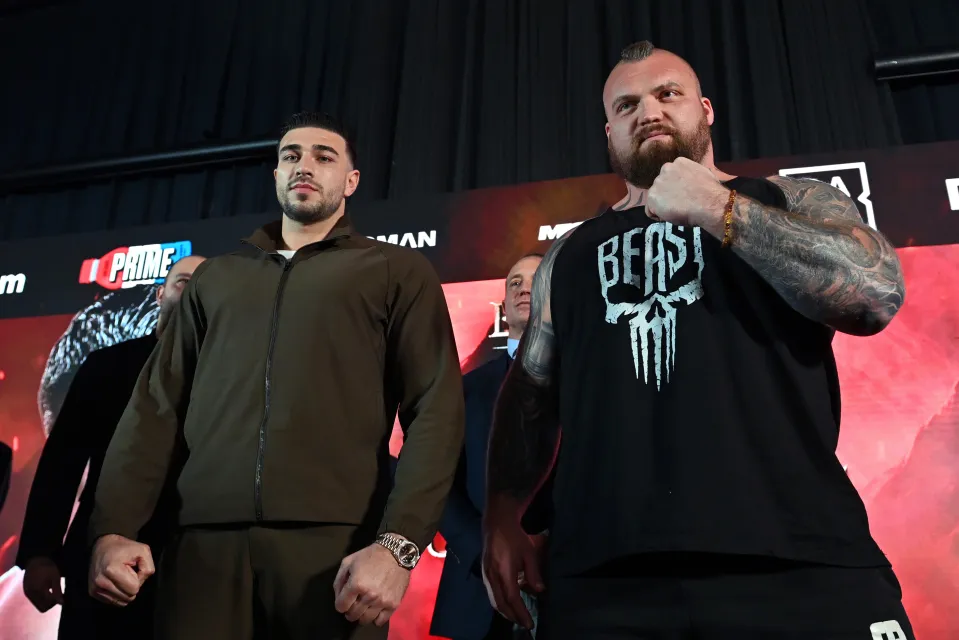 Tommy Fury (left) and Eddie Hall (right) pose for a photo after facing off during the Beauty Vs The Beast: Fury v Hall Press Conference at Glaziers Hall on April 07, 2026 in London, England