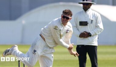Jack Carson bowling for Sussex with an umpire standing in the background