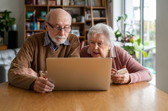 Elderly couple using laptop at home, feeling confused. Elderly couple using laptop at home, feeling confused.