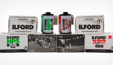 Six boxes and two rolls of Ilford black and white film, labeled as football collectors edition, are arranged in two rows. The boxes feature vintage football match photos and different Ilford film types.