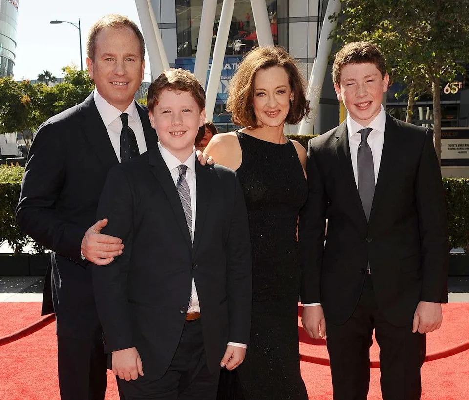 Actress Joan Cusack, center right, Richard Burke, left, and sons Miles Burke, left, and Dylan Burke, right, attend the 2013 Creative Arts Emmy Awards at Nokia Theatre L.A. Live on September 15, 2013 in Los Angeles, California.