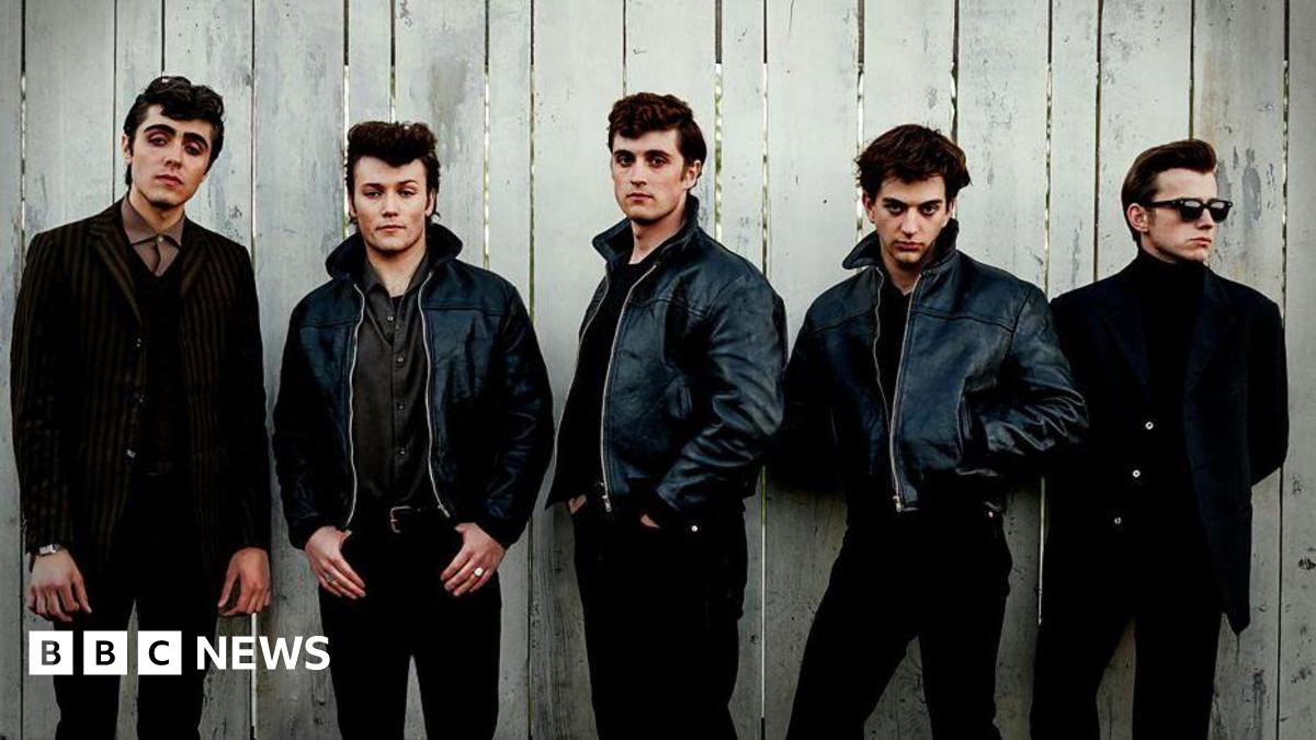 Ellis Murphy as Paul McCartney, Patrick Gilmore as Pete Best, Rhys Mannion as John Lennon, Harvey Brett as George Harrison, Louis Landau as Stu Sutcliffe. All five are dressed in black trousers and black jackets - three of them leather.