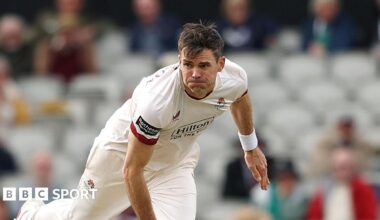Jimmy Anderson bowling for Lancashire at Old Trafford against Middlesex, having completed his delivery and in his follow-through