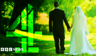 A groom dressed in a dark suit and a bride dressed in white walk hand in hand along a sunlit grassy path, surrounded by tall green trees. Bright sunlight filters through the leaves. A large green Channel 4 logo sits to the left.