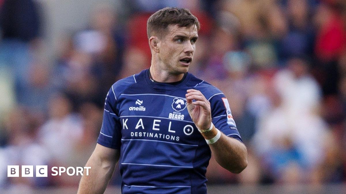 Bristol Bears rugby player AJ MacGinty wearing a dark blue rugby shirt during a Premiership match with Leicester Tigers.