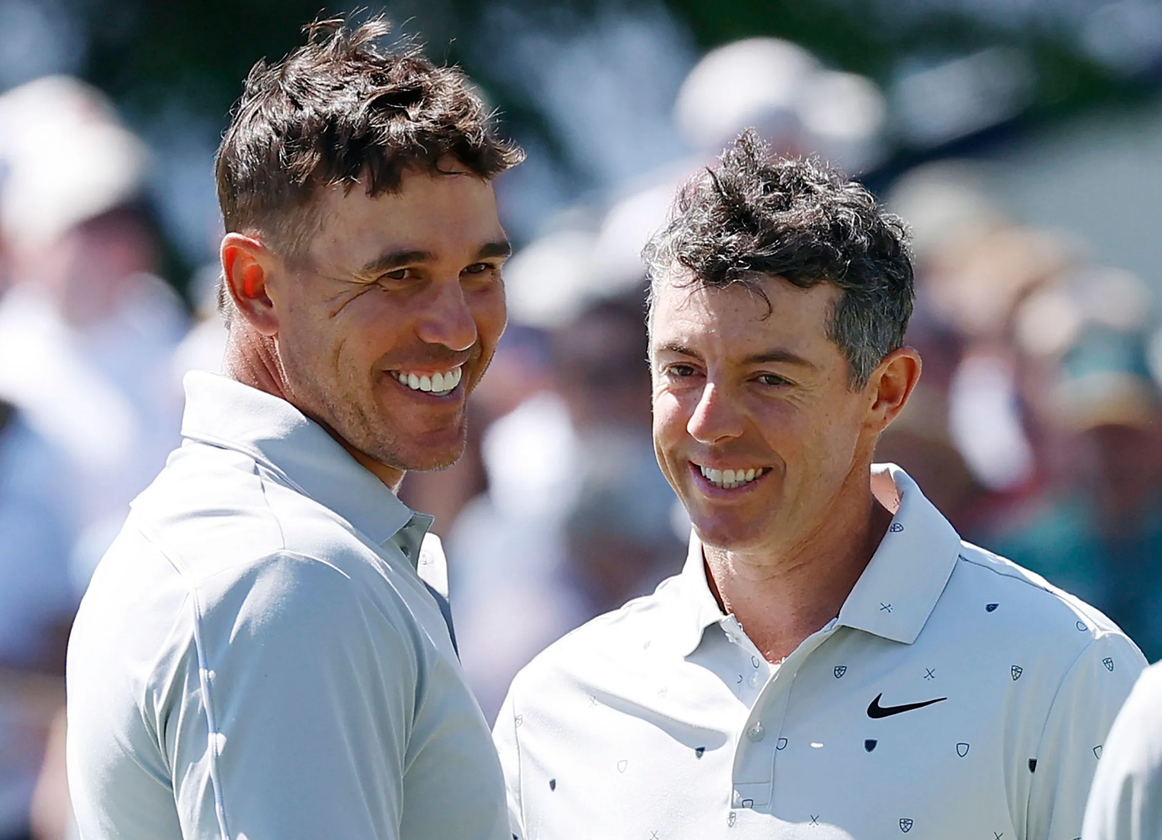 Newtown Square, United States. 16th May, 2026. Rory McIlroy (R) of Northern Ireland has a laugh with Brooks Koepka after they finished their third round at the 2026 PGA Championship at Aronimink Golf Club in Newtown Square, Pennsylvania, on Saturday,