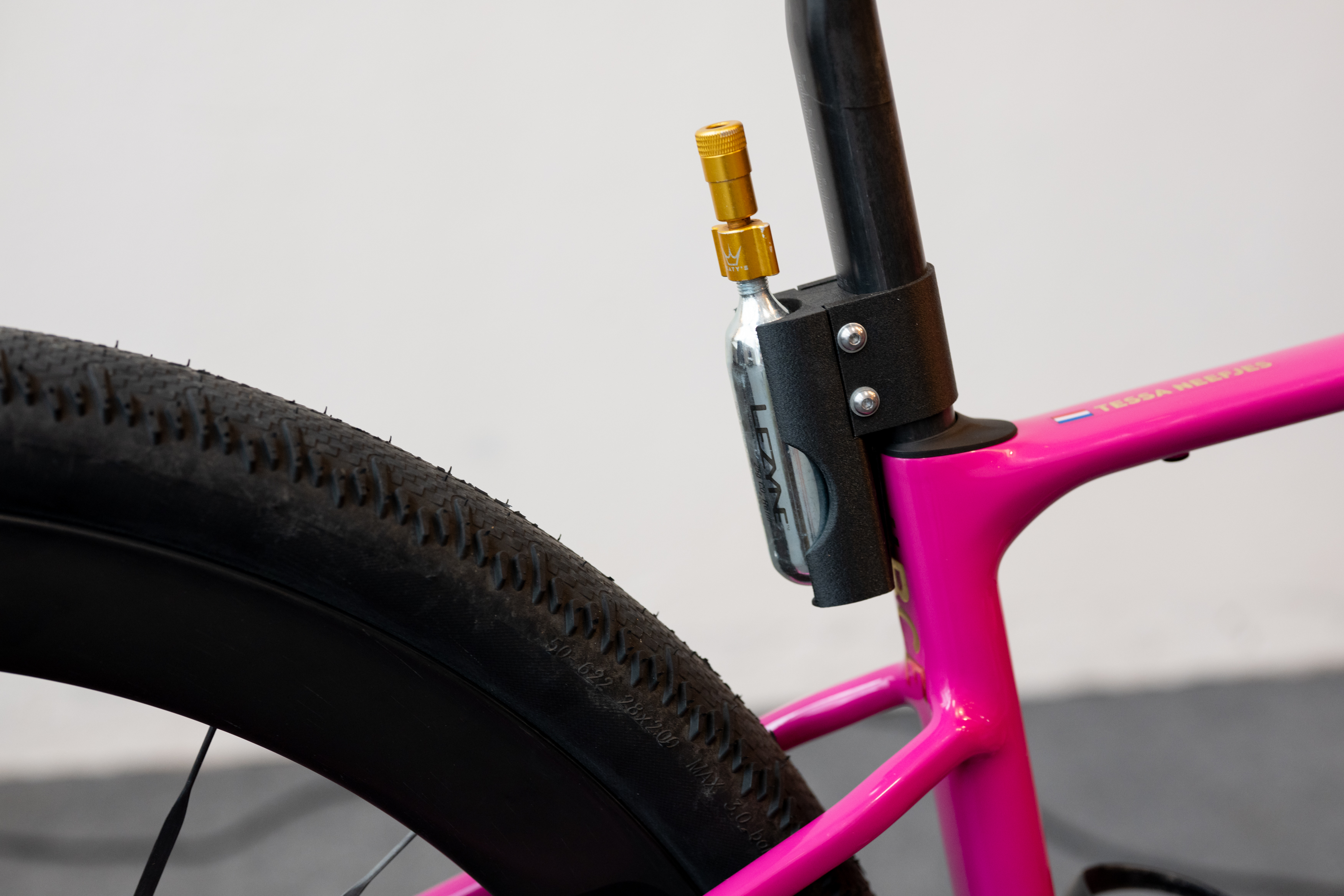 An inflator mounted behind the seat tube