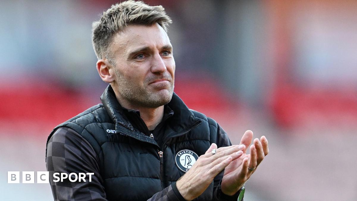 Chris Manning applauds fans during his time as Bristol City assistant head coach