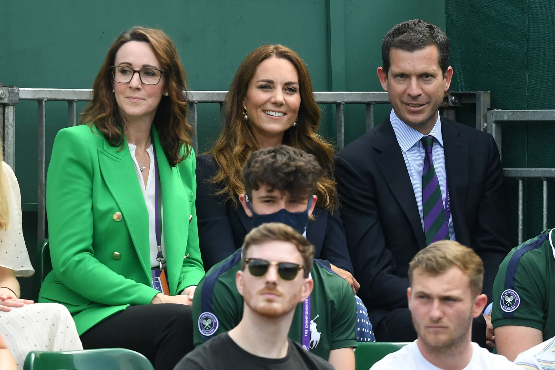 Catherine, Duchess of Cambridge smiles while watching a tennis match between Jamie Murray and Bruno Soares against Nicholas Monroe and Vasek Pospisil.