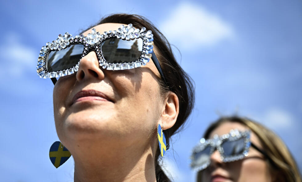 Vienna City Hall reflected in the sunglasses of a Eurovision fan in the Austrian capital