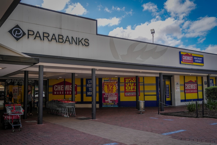 A shopping centre with a sign for PARABANKS and CHEMIST WAREHOUSE