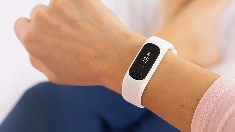 The Garmin vívosmart 5 on a person's right wrist