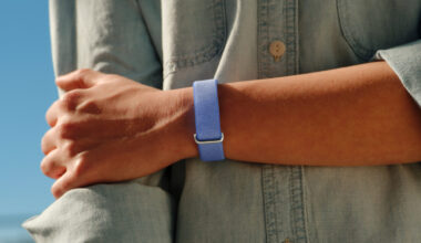 A lifestyle photo of someone wearing the Google Fitbit Air in its Lavender color.