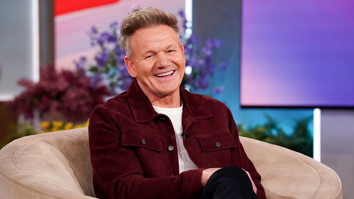 Gordon Ramsay sitting on a couch smiling during The Jennifer Hudson Show taping